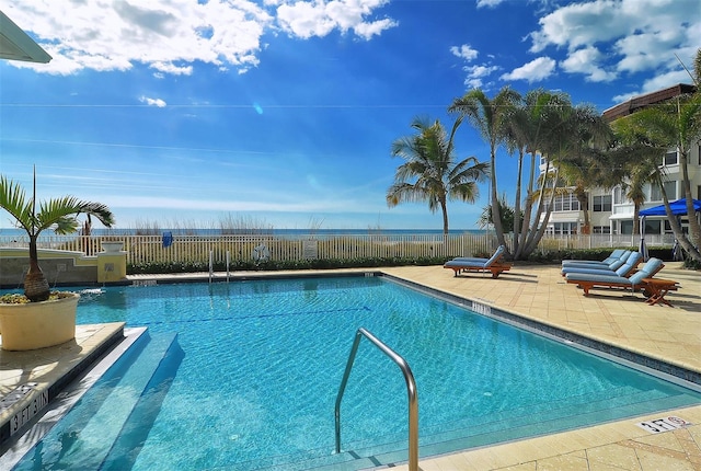 view of swimming pool with a patio area