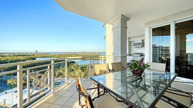 balcony featuring a water view and grilling area