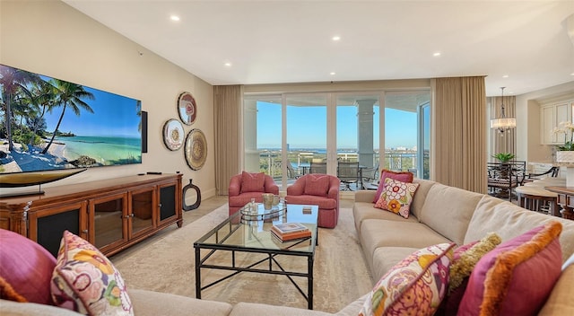 living room with recessed lighting and baseboards