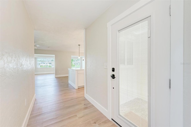 hallway featuring light wood-type flooring