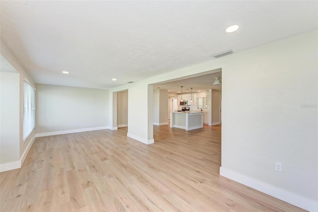 unfurnished living room featuring light hardwood / wood-style flooring