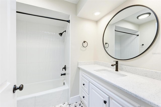 bathroom featuring tile patterned floors, vanity, and tiled shower / bath combo