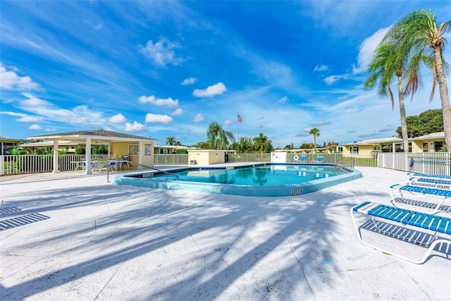 view of swimming pool with a patio