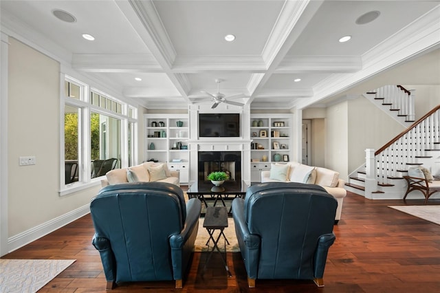 living room with dark hardwood / wood-style flooring, ornamental molding, coffered ceiling, ceiling fan, and beamed ceiling