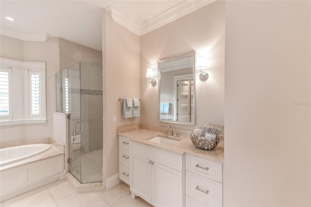 bathroom featuring tile patterned floors, vanity, separate shower and tub, and ornamental molding