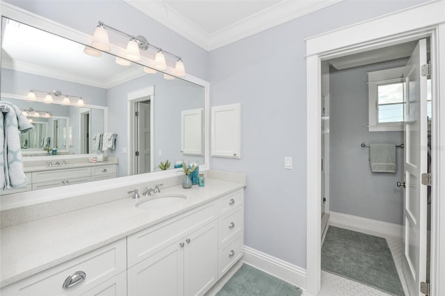 bathroom with crown molding, tile patterned flooring, and vanity