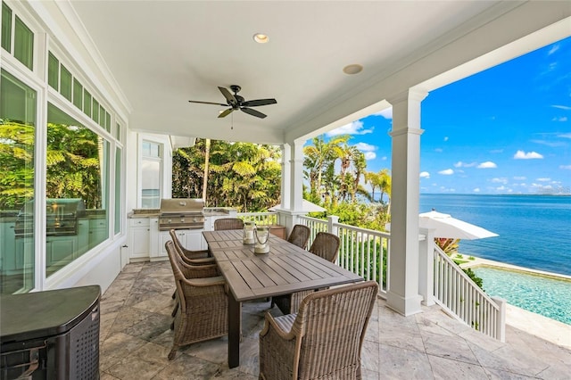 exterior space featuring ceiling fan, a water view, and a healthy amount of sunlight