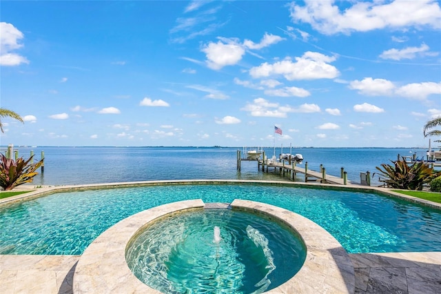 view of pool featuring an in ground hot tub, a boat dock, and a water view