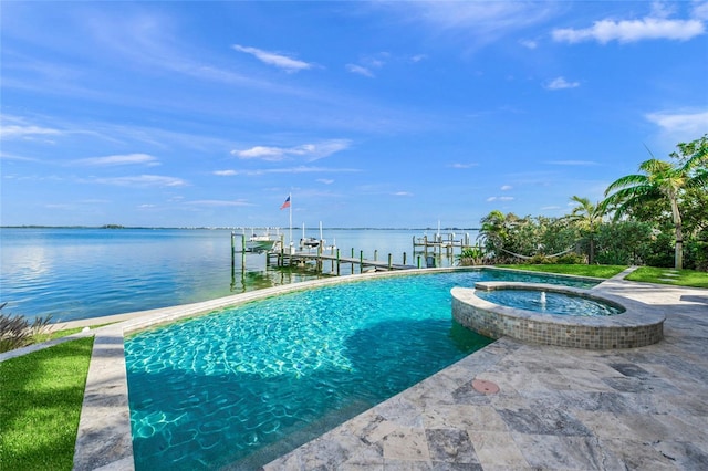 view of swimming pool with an in ground hot tub, a boat dock, and a water view