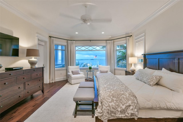 bedroom with hardwood / wood-style flooring, ceiling fan, and ornamental molding