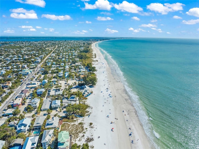 drone / aerial view with a water view and a beach view