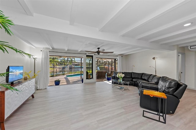 living room with beam ceiling, light wood-type flooring, and ceiling fan