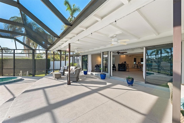 view of patio with an outdoor hangout area, glass enclosure, fence, and a ceiling fan