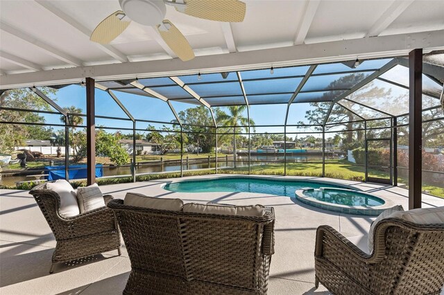 608 69th Ave W, Bradenton, FL 34207 - view of pool with a water view, ceiling fan, glass enclosure, and a patio area