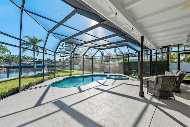 608 69th Ave W, Bradenton, FL 34207 - view of swimming pool with a patio area, a water view, a lanai, and a pool with connected hot tub