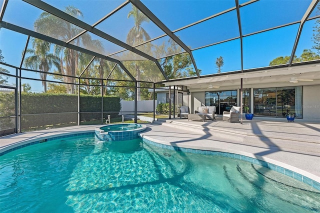 view of swimming pool with ceiling fan, a patio area, an in ground hot tub, and glass enclosure