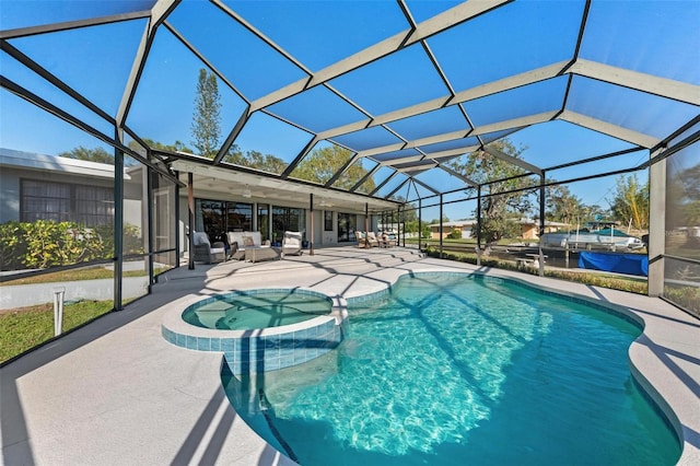 view of swimming pool featuring a lanai, a patio area, a pool with connected hot tub, and an outdoor living space