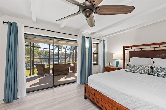 bedroom with ceiling fan, beamed ceiling, a water view, access to outside, and light wood-style floors