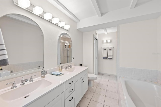 bathroom with vanity, tile patterned floors, a relaxing tiled tub, toilet, and beam ceiling