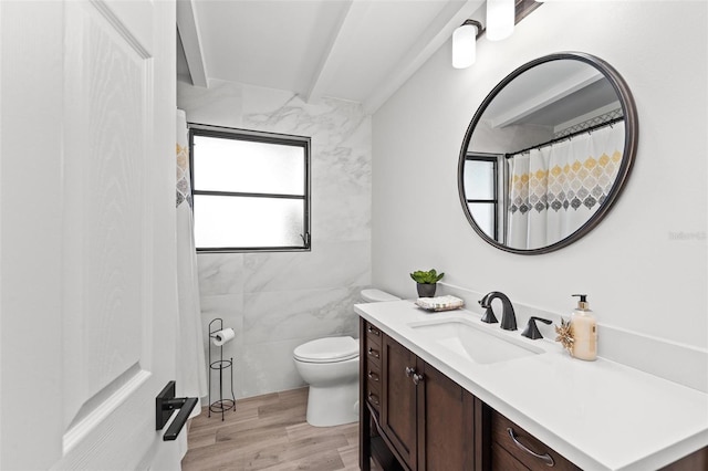 full bathroom featuring beam ceiling, toilet, vanity, wood finished floors, and a shower with curtain