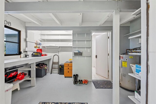 608 69th Ave W, Bradenton, FL 34207 - below grade area with electric water heater and a workshop area