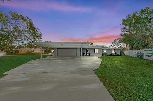608 69th Ave W, Bradenton, FL 34207 - ranch-style house featuring driveway, a carport, a garage, and stucco siding