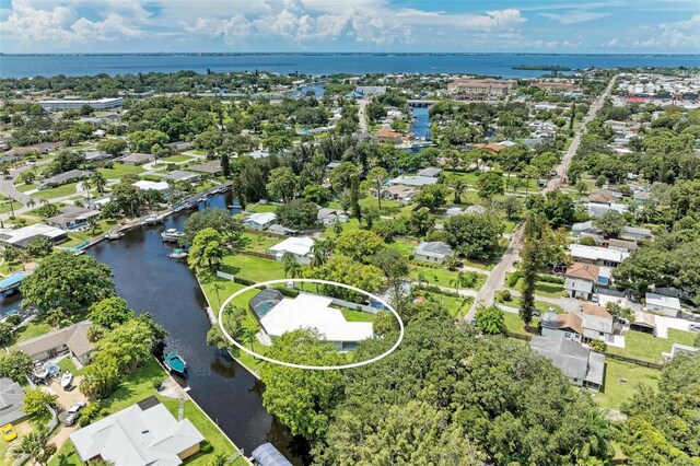 drone / aerial view with a residential view and a water view