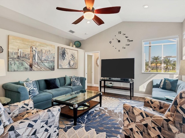 living room featuring ceiling fan, hardwood / wood-style floors, and vaulted ceiling