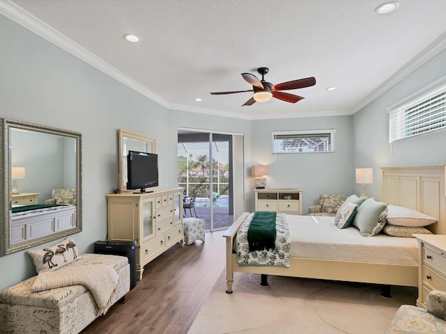 bedroom with access to exterior, wood-type flooring, multiple windows, and ceiling fan