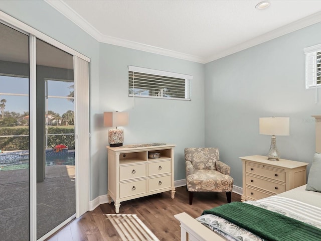 bedroom with access to exterior, dark hardwood / wood-style floors, and ornamental molding