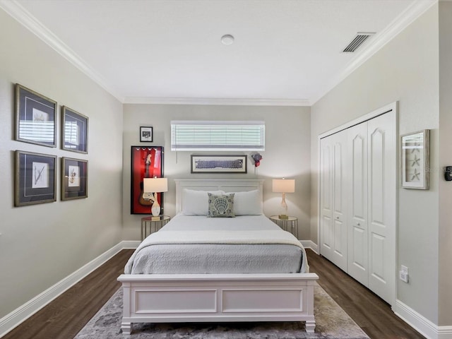 bedroom with dark hardwood / wood-style flooring and ornamental molding