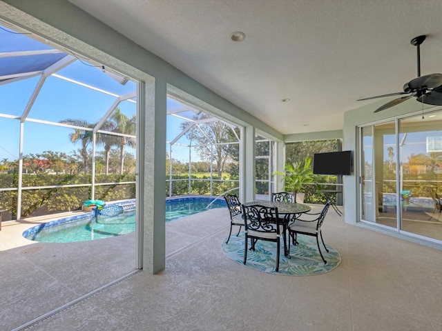 exterior space featuring a lanai, a patio area, and ceiling fan