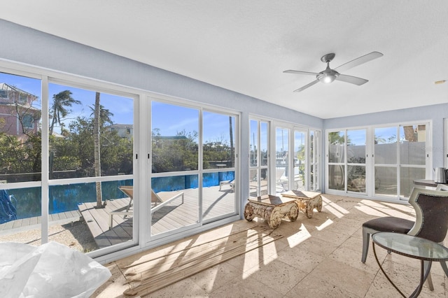 sunroom / solarium with ceiling fan