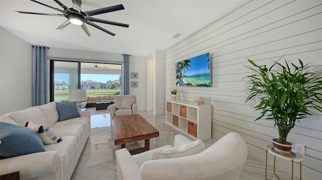 living room with wood walls