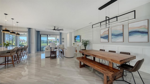 dining space with ceiling fan