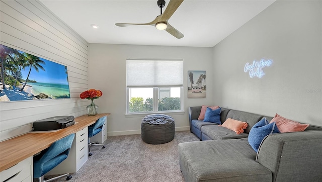 office space with light carpet and ceiling fan