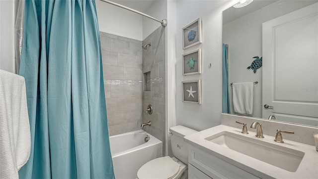 full bathroom with vanity, toilet, and shower / tub combo