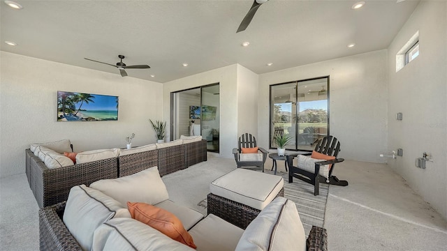 living room featuring ceiling fan and light colored carpet