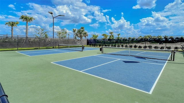 view of sport court with basketball hoop