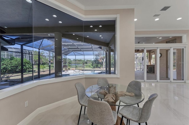 dining space featuring ornamental molding