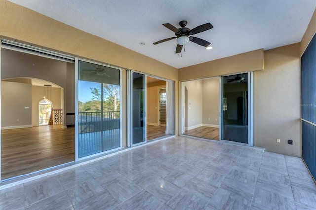 view of patio / terrace featuring ceiling fan