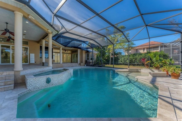 view of swimming pool featuring an in ground hot tub, ceiling fan, a patio area, and glass enclosure