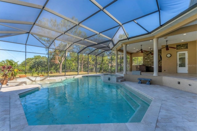 view of pool with a lanai, a patio area, and ceiling fan