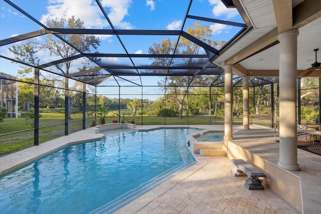 view of pool with a lanai, a patio area, and a pool with connected hot tub