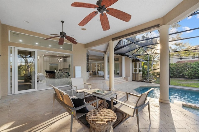 view of patio / terrace with an outdoor pool, glass enclosure, ceiling fan, and an outdoor living space