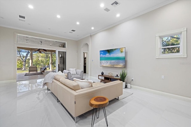 living room featuring baseboards, visible vents, arched walkways, crown molding, and recessed lighting