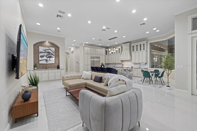 living room featuring arched walkways, ornamental molding, visible vents, and recessed lighting