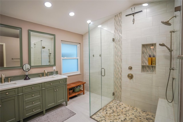 bathroom featuring vanity and a shower with shower door