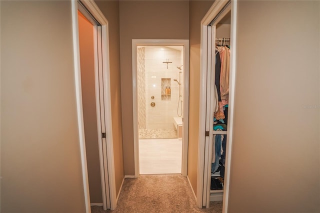 hallway with light colored carpet