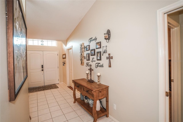 tiled entrance foyer with vaulted ceiling